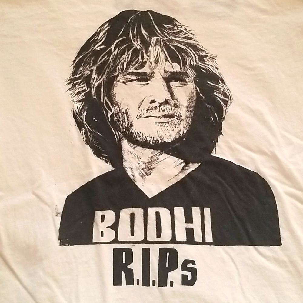 Point Break Bodhi rips R.I.P. T-shirt
